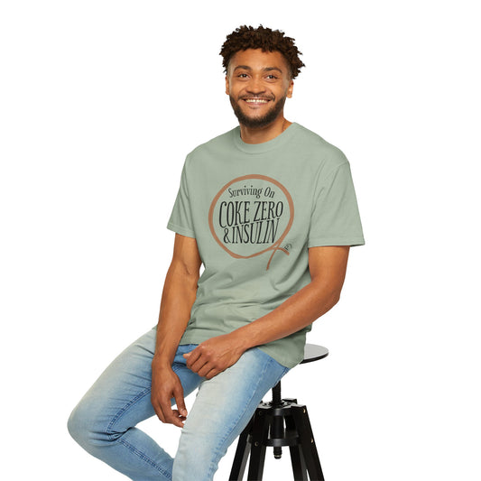 Surviving on Coke Zero Western Diabetes Tshirt worn by a man sitting on a stool, showcasing casual style and humor.