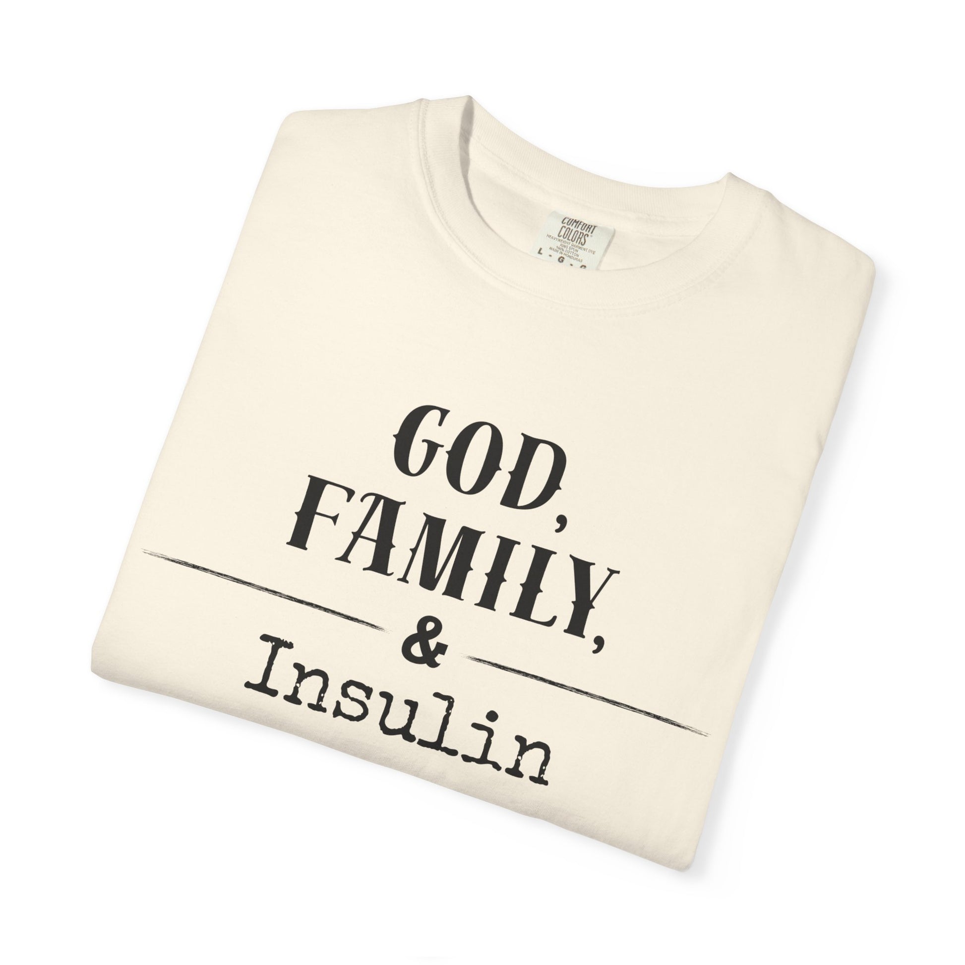 God, Family, & Insulin Diabetes T-Shirt folded on white background, promoting faith and diabetes awareness.