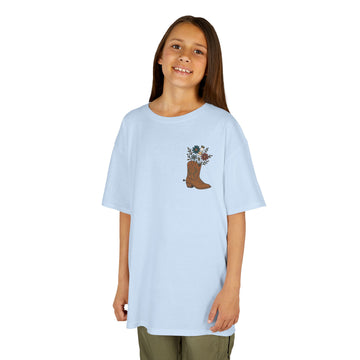 Kids Floral Insulin Boot Tee on a smiling child, promoting diabetes awareness and comfort in style.