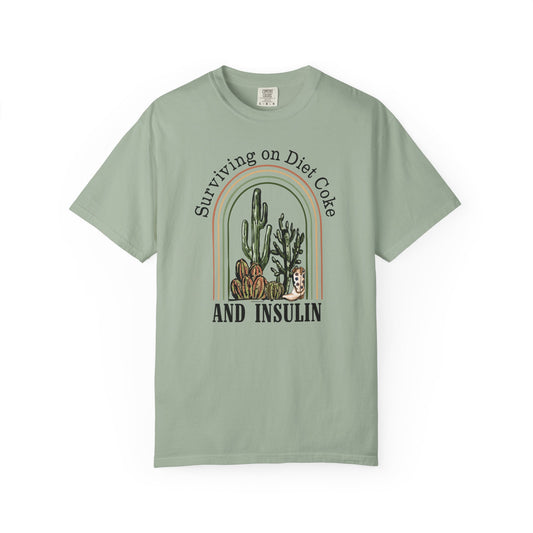 Surviving on Diet Coke Diabetes TShirt featuring cacti design in warm tones.