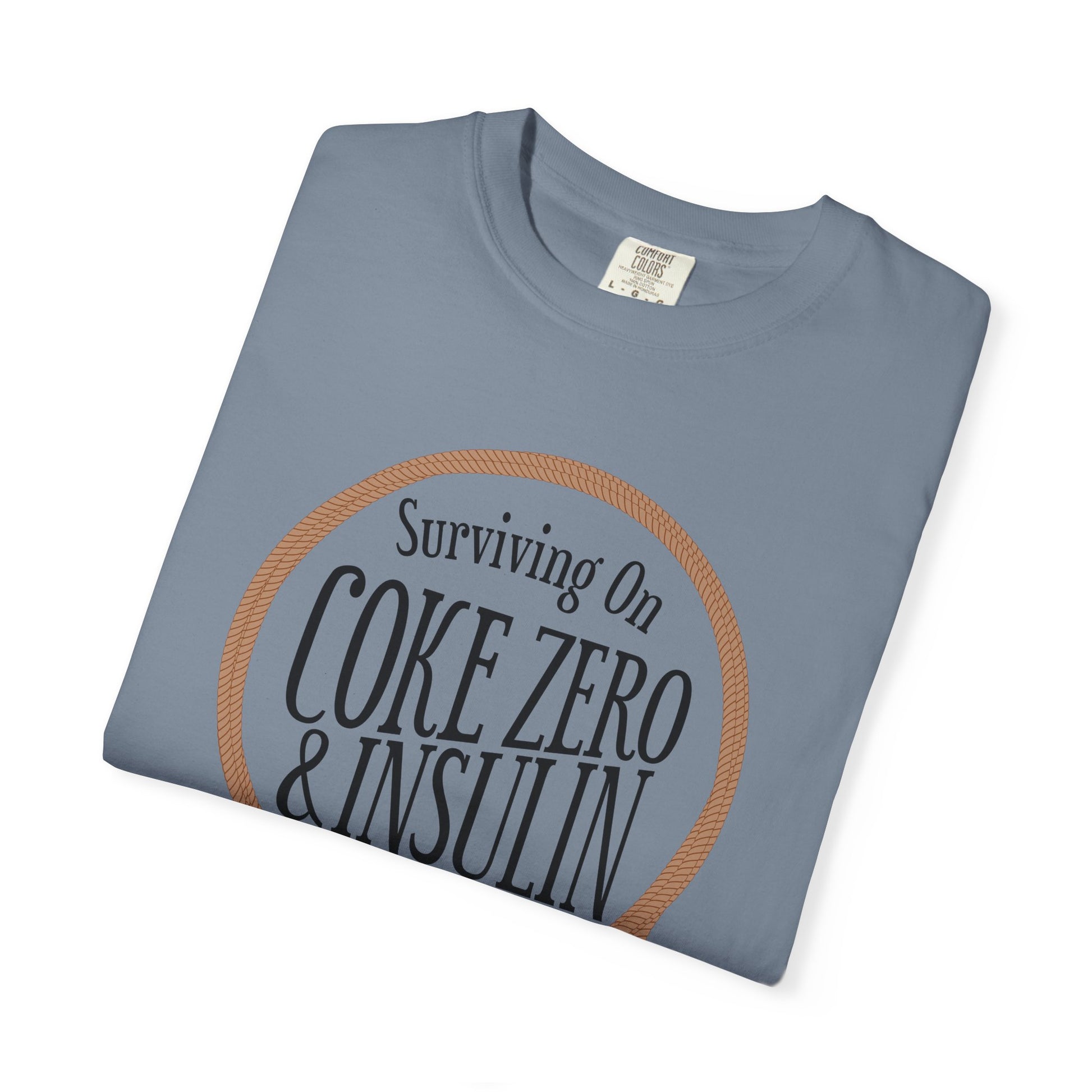 Surviving on Coke Zero Western Diabetes Tshirt featuring curled rope design on a blue cotton background.