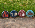 Four diabetes awareness buttons with text on a grassy background